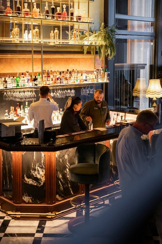 Tall backbar lit in warm gold