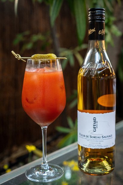 Spritz beside a bottle of Giffard elderflower liqueur