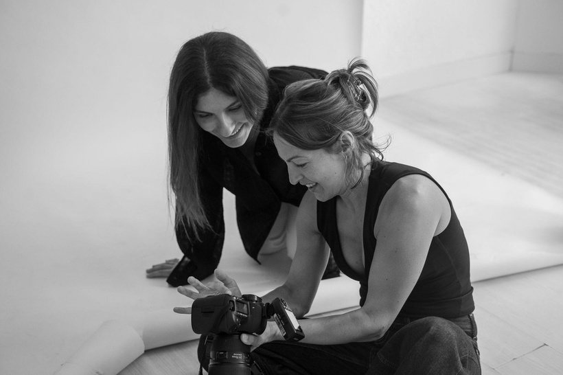 Bianca and Annette reviewing shots on the camera during a studio session