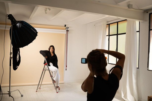 Studio set with softbox and a sitter on a ladder