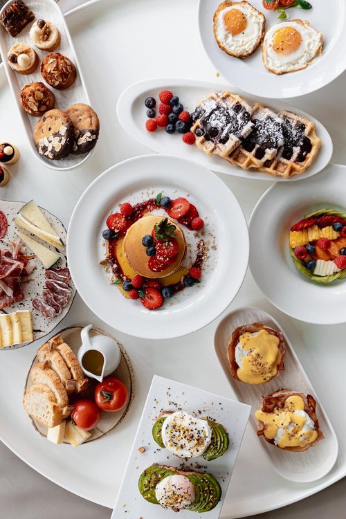 Overhead of an abundant hotel breakfast spread