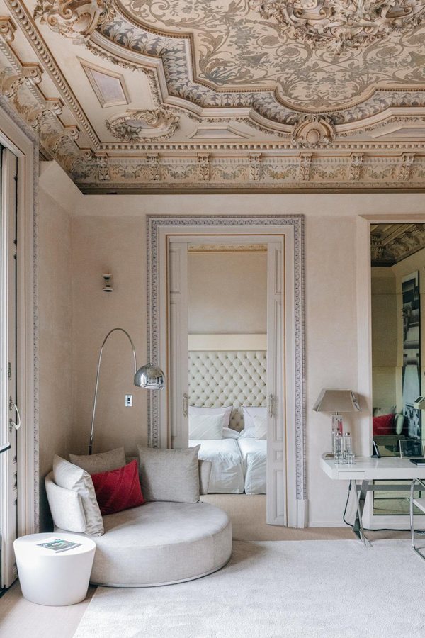 Suite sitting room under an ornate plaster ceiling