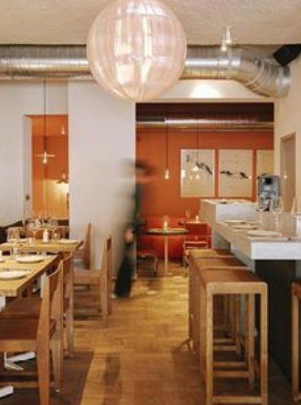 Bright dining room with a paper lantern