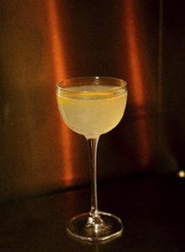 Pale cocktail in amber light