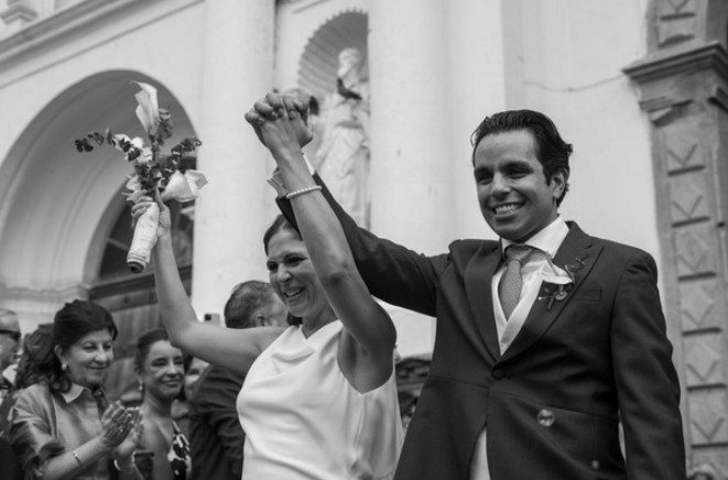 Newlyweds cheering outside the church